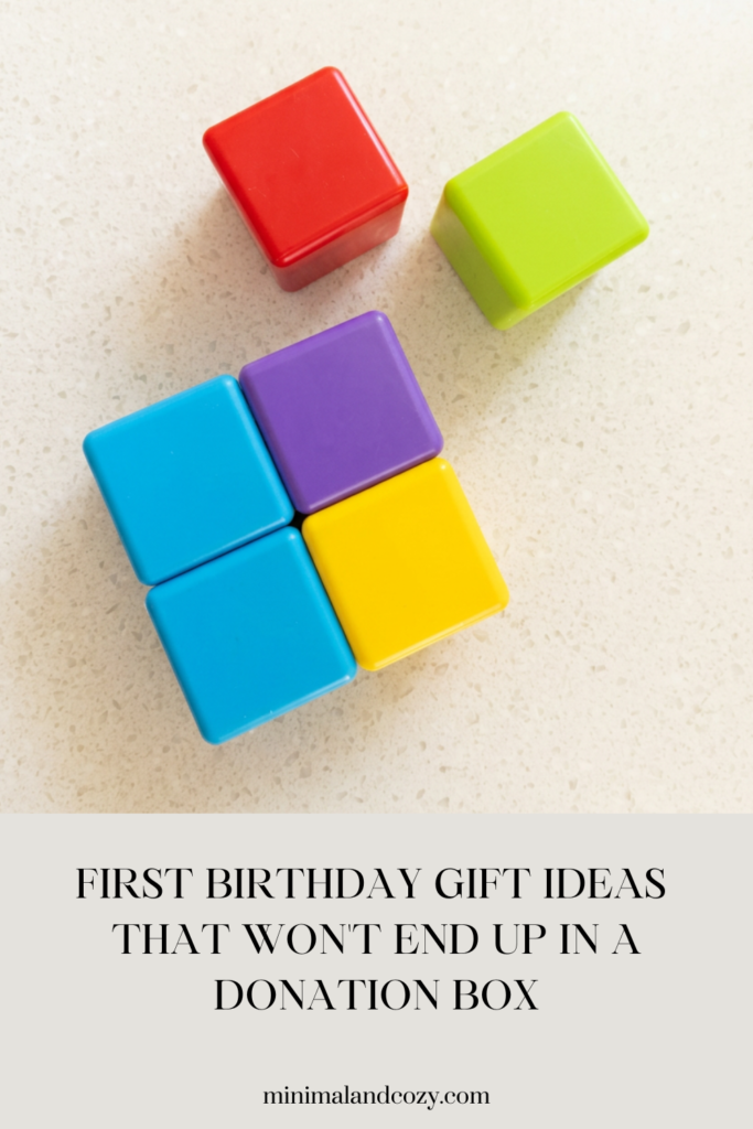 Colorful stacking blocks for babies arranged on a white surface — first birthday gift ideas that won't end up in a donation box
